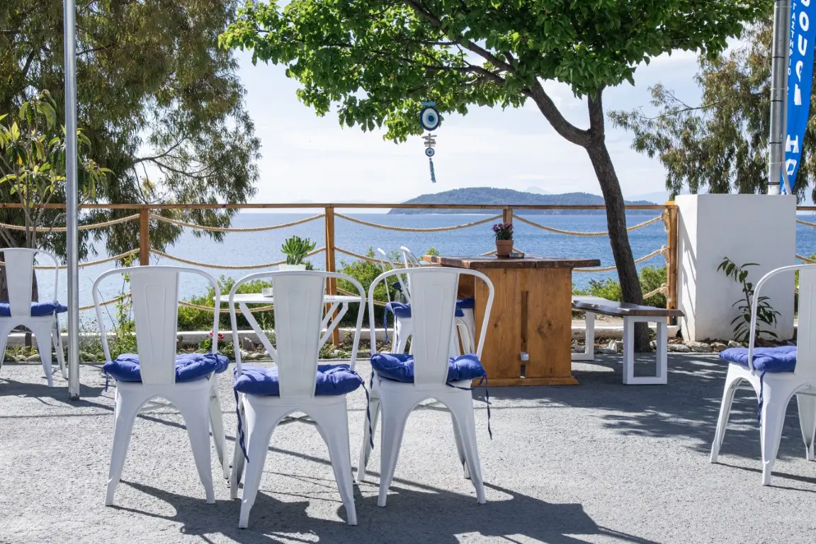 Dough hook outdoor sitting by the sea in skiathos megali ammos beach min